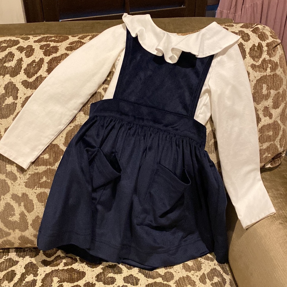 Pink chicken navy apron dress in girls size 6.